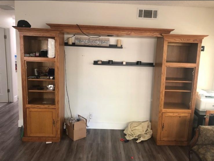 Oak entertainment center before it was altered, with an open center and no integrated shelving