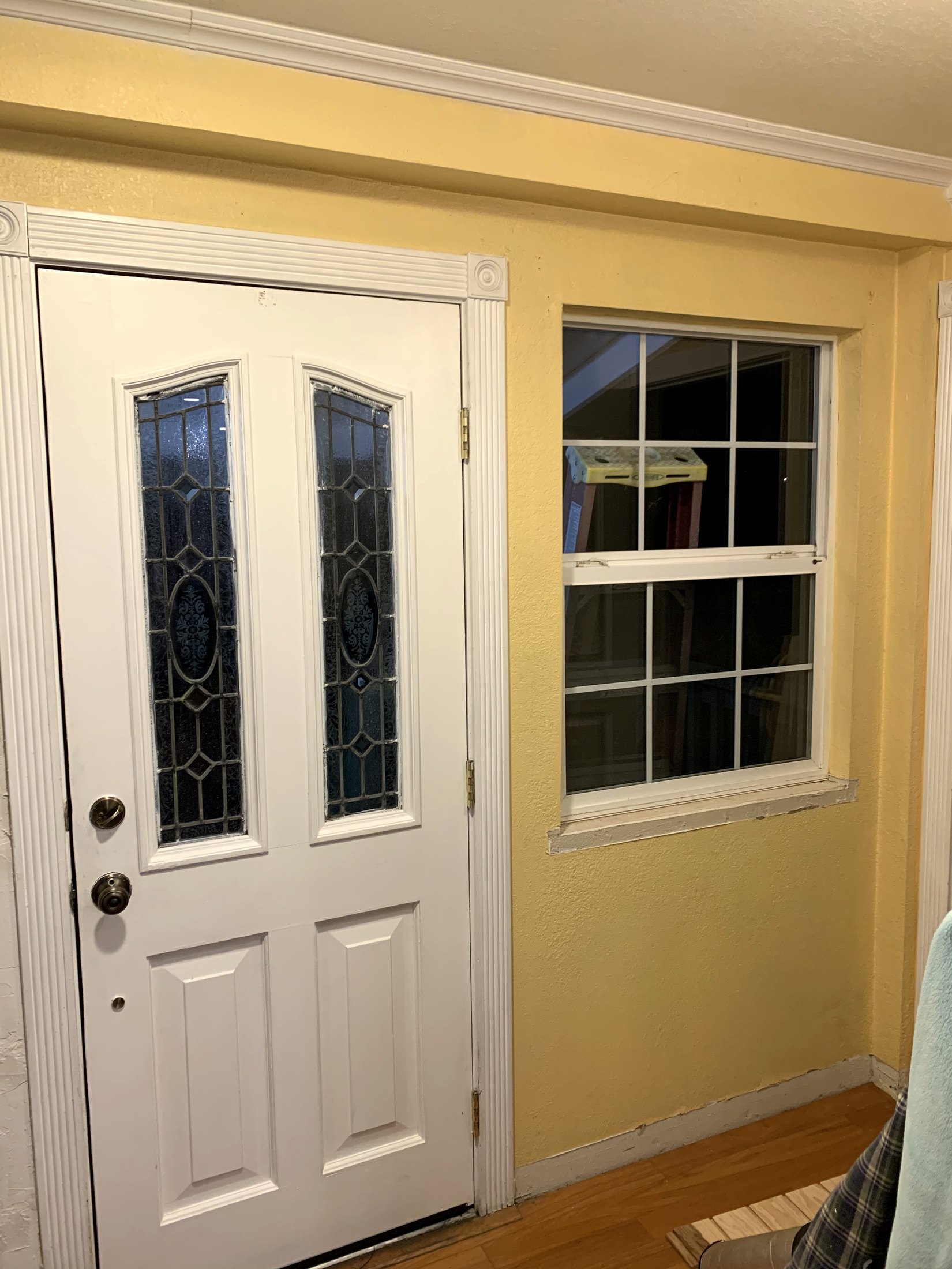Earlier yellow California farmhouse entry beside the front door