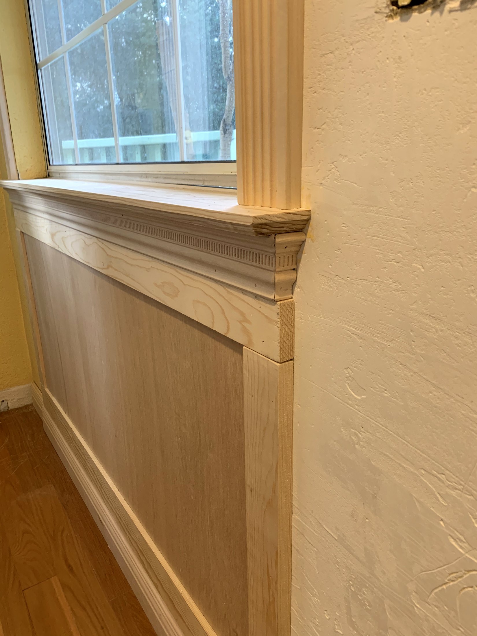 Architectural paneling being measured and built by hand