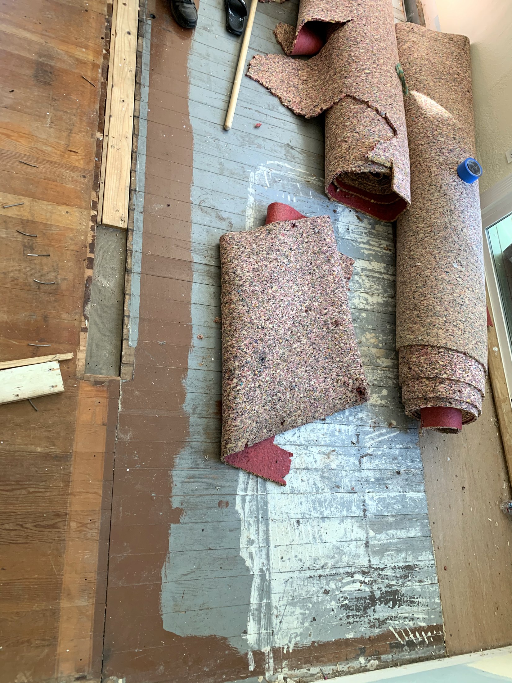 Original hardwood floor discovered beneath carpet and padding