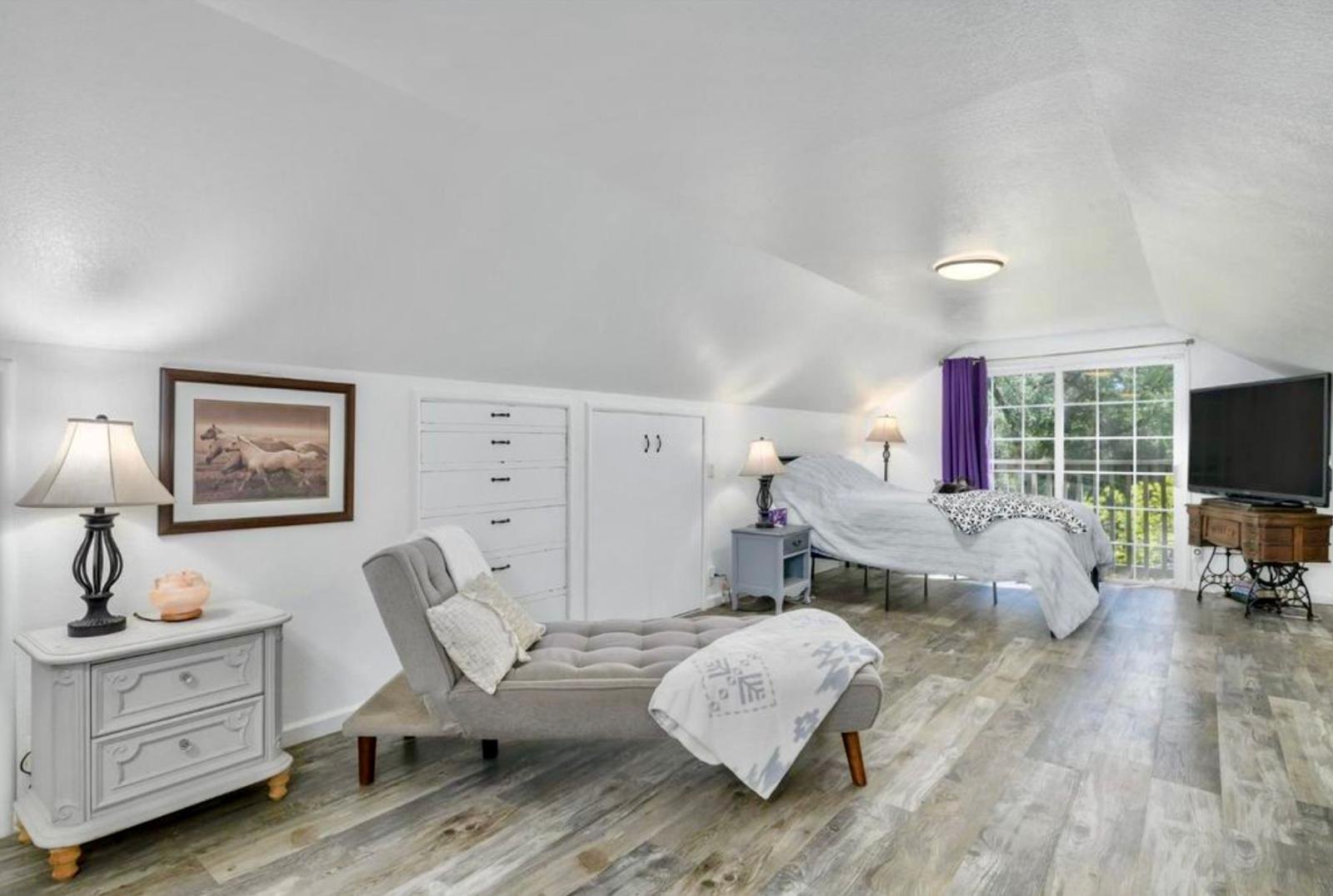 Finished primary bedroom created within the former attic